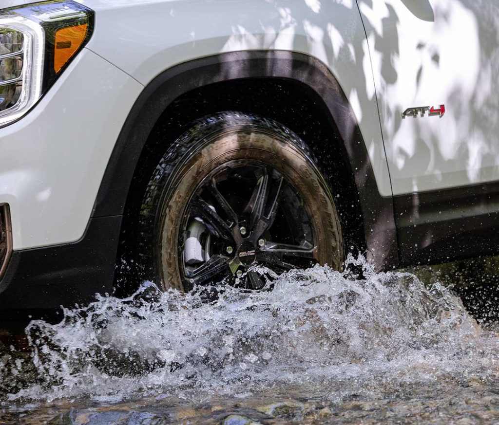 GMC Vehicle driving through water